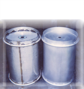 Two stainless steel vessels showing before and after glass bead polishing